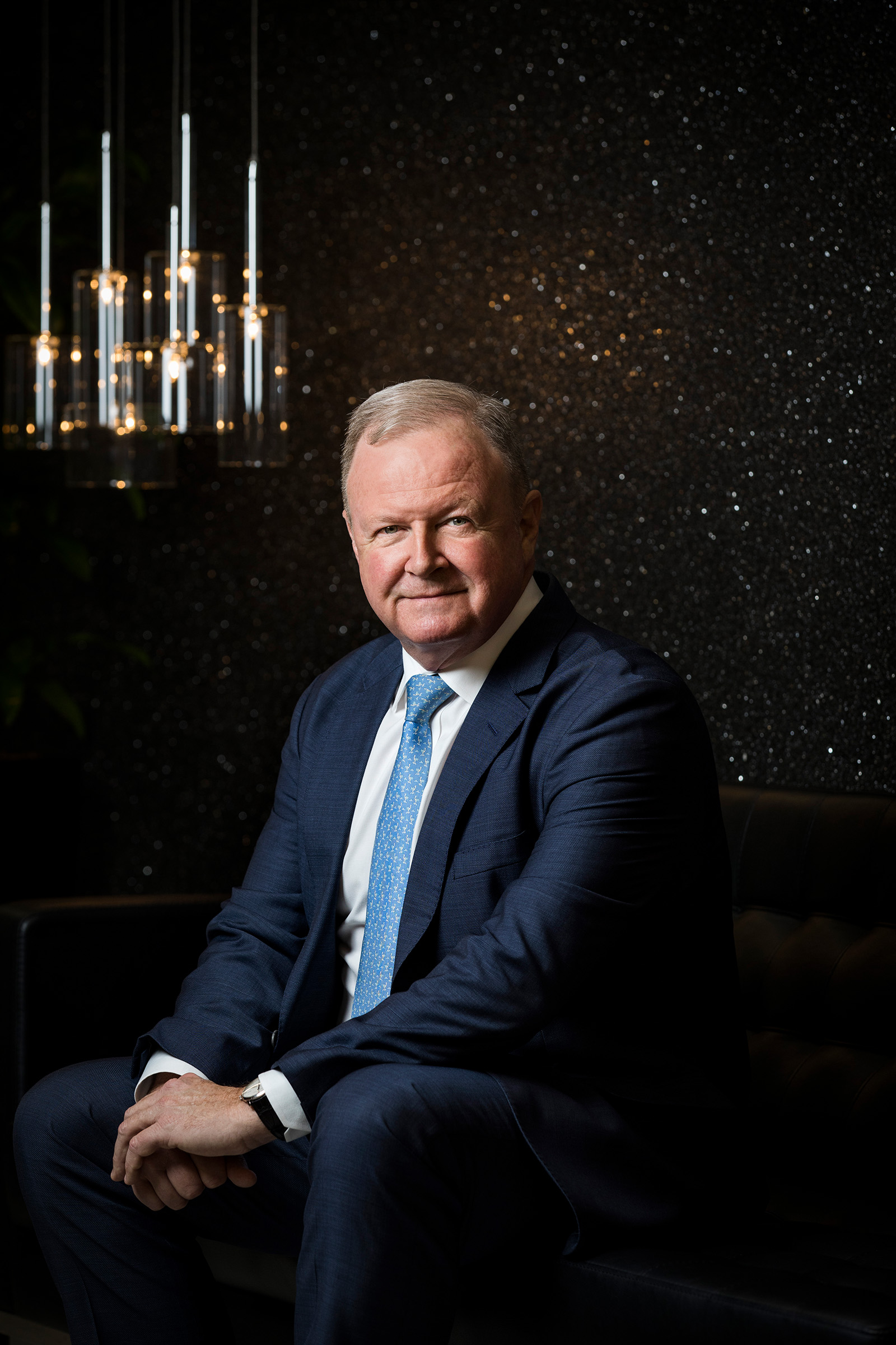 Corporate editorial photography Company Director Magazine Geoffrey Babidge CEO The a2 Milk Company seated on couch