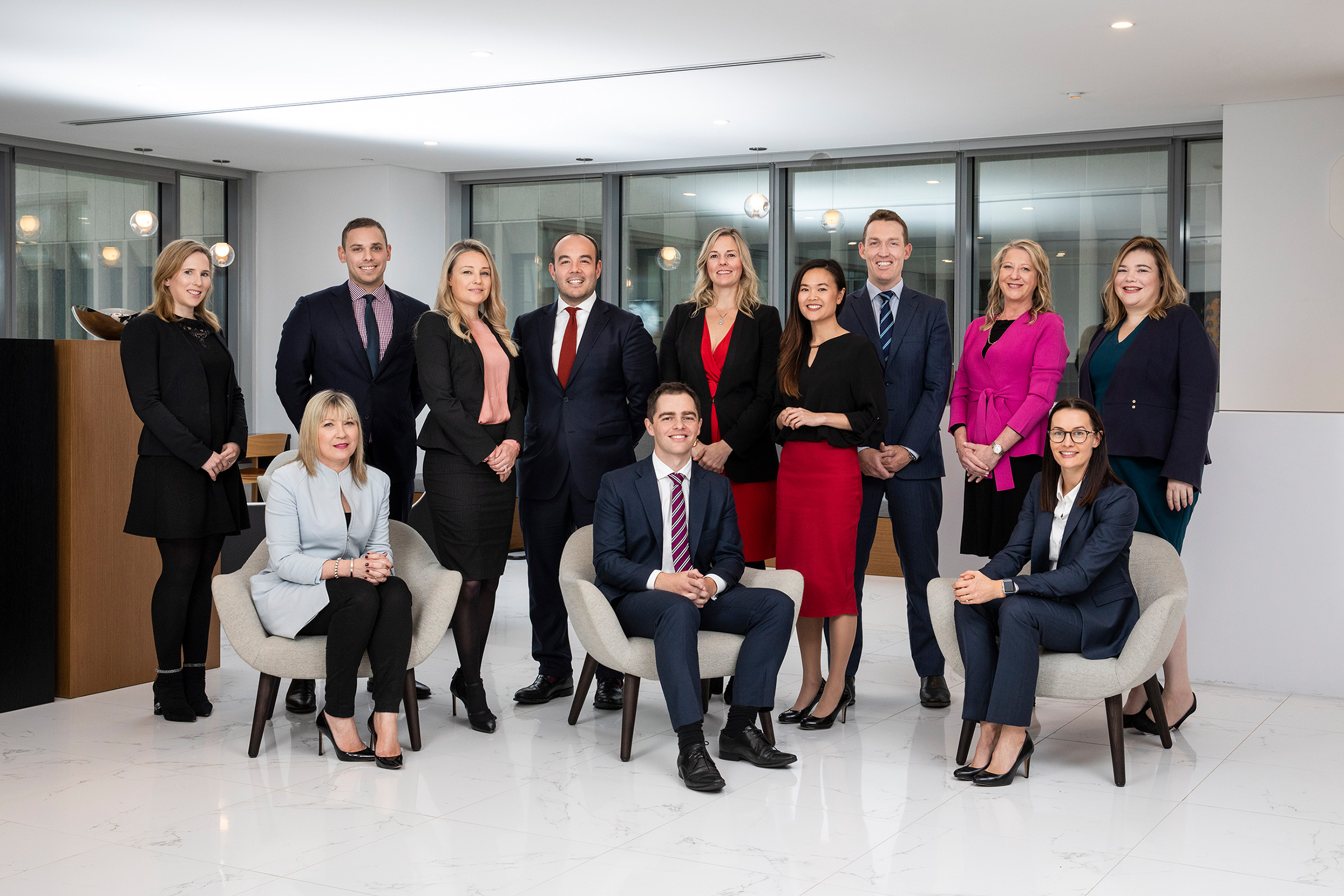 Location corporate group photography of 12 people in reception area