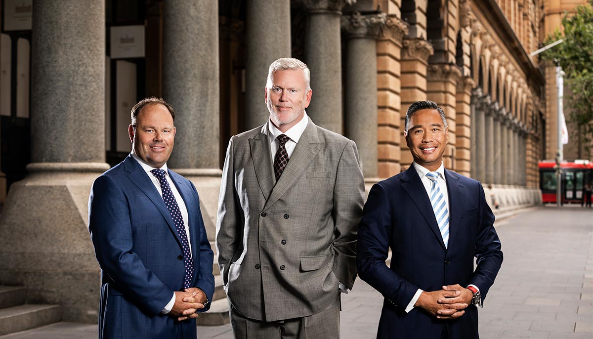 Corporate group shot of 3 males in suit and ties photographed on Martin Place Sydney